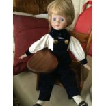 Andrew Schofield Victorian Doll sitting on a very cute wooden chair