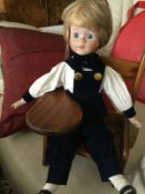 Andrew Schofield Victorian Doll sitting on a very cute wooden chair