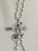 Boutique Rice/ Seed Pearl necklace with mother of Pearl tassle