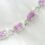 A beautiful 18ct white gold pink sapphire and diamond multicluster articulated bracelet