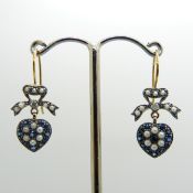 A pair of Sapphire, seed pearl and Diamond "heart and bow" drop earrings in a vintage style