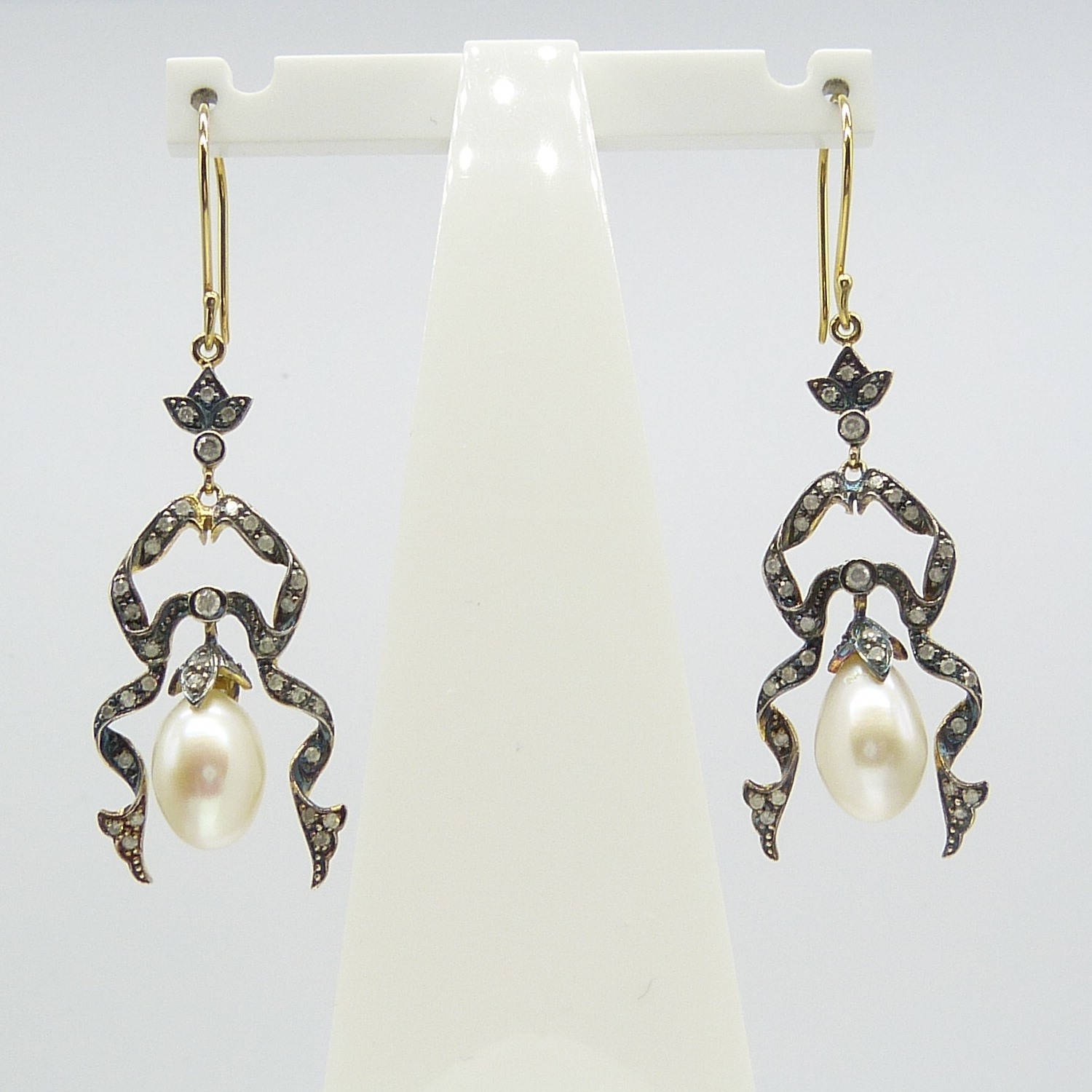 A pair of long drop ribbon-style earrings set with cultured pearls and Diamonds