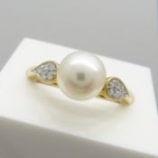 A 9ct yellow gold white cultured pearl and diamond dress ring