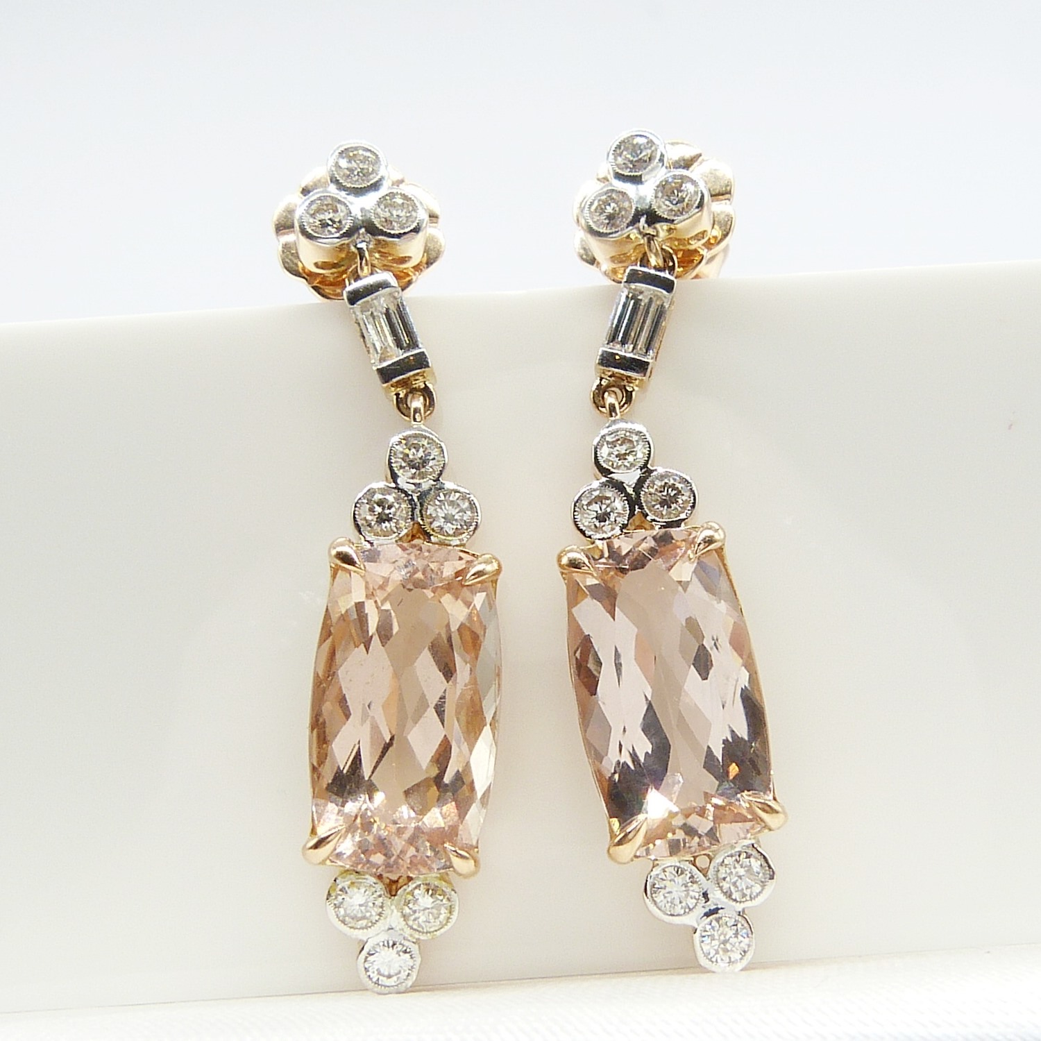 A fine quality pair of checkerboard cushion-cut morganite and diamond drop earrings in rose gold