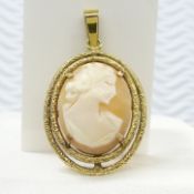 A pre-owned, 9ct Gold carved Cameo pendant in excellent condition