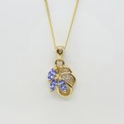 A vintage-style 9ct yellow Gold marquise Tanzanite gemstone and Diamond necklace