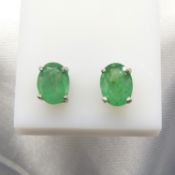 A pair of oval-cut green Emerald gemstone Silver ear studs