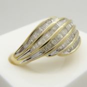 A swirling 5-row 0.50 carat baguette-cut Diamond ring in 9ct yellow Gold