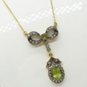 A vintage-style necklace set with green Peridot gemstones and Diamonds, boxed