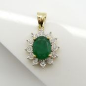 An Emerald and Diamond cluster pendant in 9ct yellow Gold