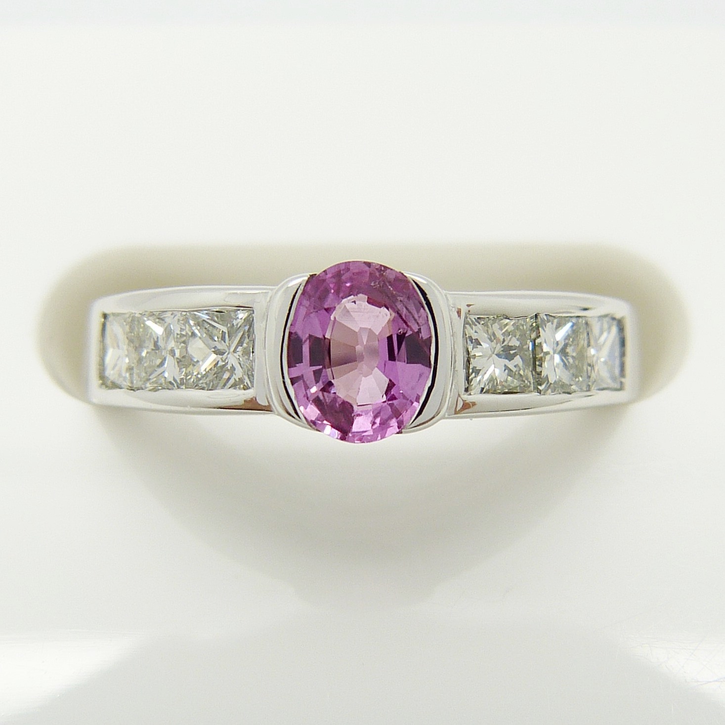 A pink Sapphire gemstone and princess-cut Diamond ring in 18ct white Gold