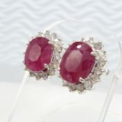 A pair of large cushion-cut Ruby and round brilliant-cut Diamond cluster earrings in 18ct white go