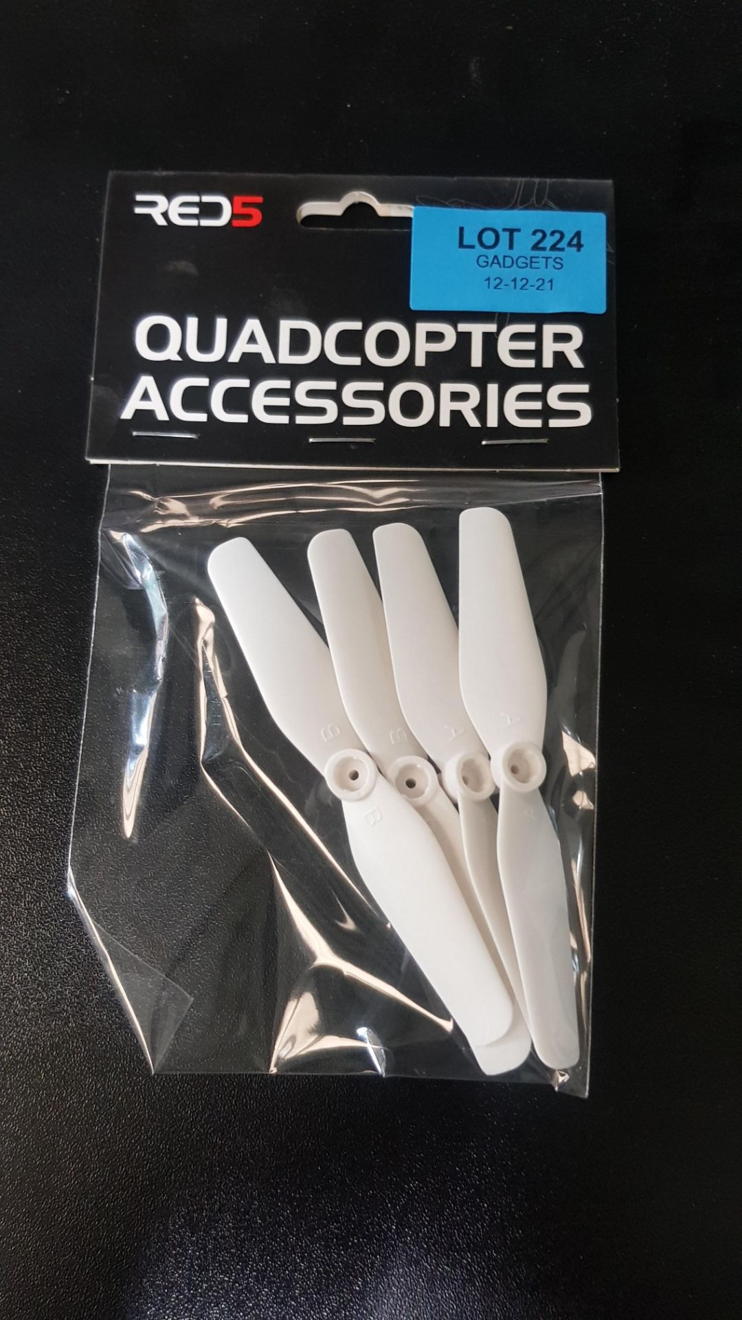 (14) Approx 210x Quadcopter Red5 Accessories Packs (All New, Sealed). Each Pack Contains 4x White Q