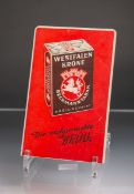 Blechwerbeschild "Westfalen Krone" (1950er Jahre), auf rotem Fond Aufschrift "Der vielgerauchte