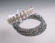 Konvolut von 2 Swarovski-Armreifen, bestehend aus: 1x Armreif "Crystaldust Double" aus Edelstahl