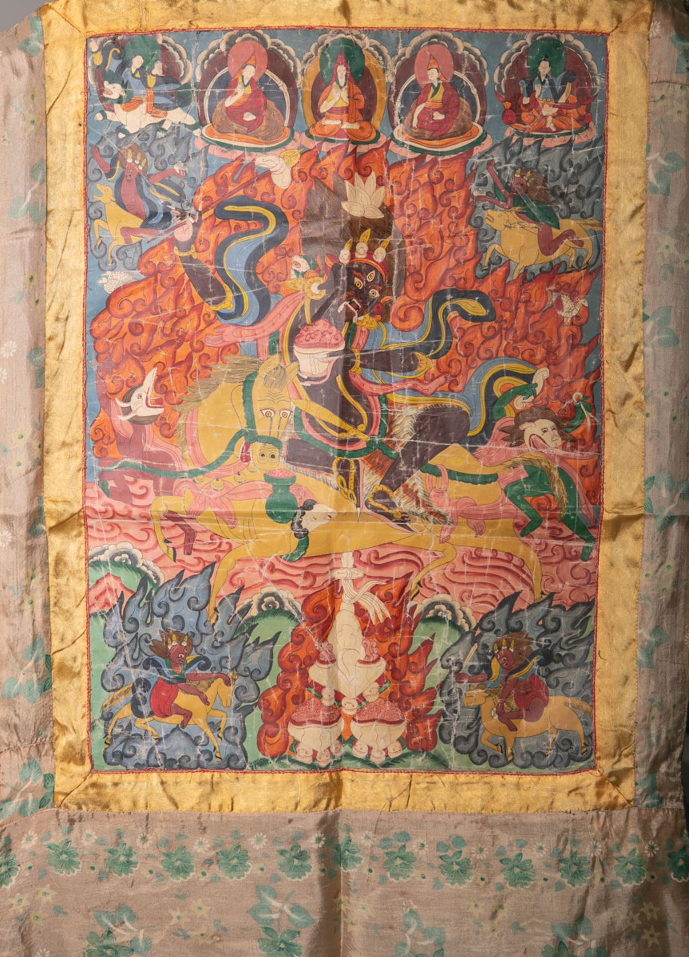 Thangka (wohl Indien), polychrome Malerei, Umrandung feines Stoffgewebe m. grünen Blüten bemalt, ca.