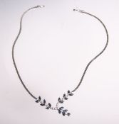 Collier 750 WG, ausgefasst m. 19 Brillanten von zus. ca. 1.20 ct/LC-vvs1/E-F u. 17 Saphiren (davon