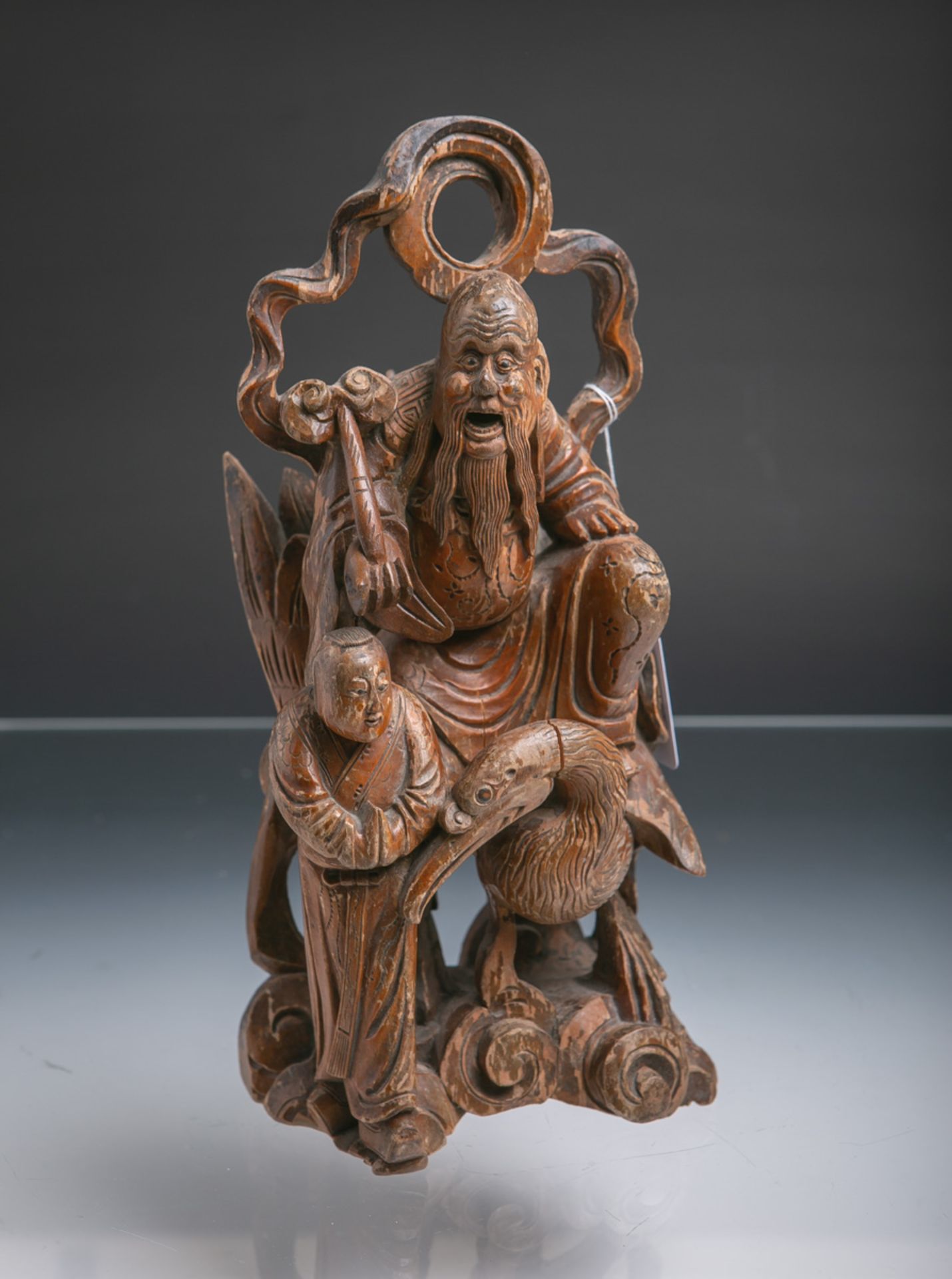 Figur einer Gottheit auf einem Kranich sitzend u. seinem Diener (Alter u. Herkunft unbekannt)