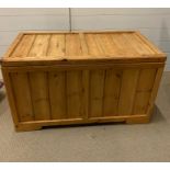A pine chest with hinged lid (H53cm W90cm D46cm)
