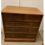 A two over three chest of drawers with brass handles (H90cm W91cm D51cm)