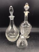 Two glass decanters and a glass bell