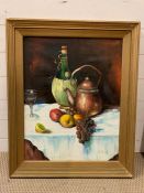 A 20th century Continental school, Still life with carafe of wine with raffia covering, signed lower