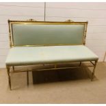 A Three seater salon settee on a brass frame with green upholstery (H 84 cm x W 44 cm x L 118 cm)