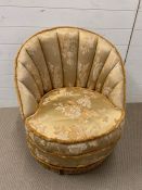 A shell back bedroom chair or club chair in gold