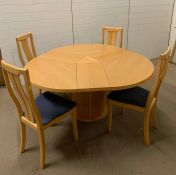 A Skovby round extending dining table made in Denmark, with four chairs (H74cm Diam 149cm)