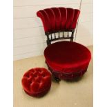An ebonized and gilt bedroom chair upholstered in red velvet with a shell design back, along with