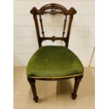 A William IV Style dining chair with carved mid side rails upholstered seat on reeded turned legs