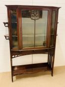 A Mahogany side cabinet, the top of the glazed main door has a gilt metal Art nouveau inlaid and