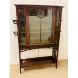 A Mahogany side cabinet, the top of the glazed main door has a gilt metal Art nouveau inlaid and