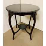 A Mahogany side table or center table with pierced lattice work to frieze Diameter 62 cm x Height 73