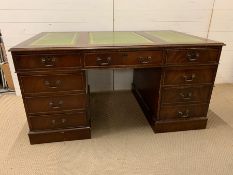 A pedestal desk with green leather top and drawers to side (H78cm W152cm D91cm)