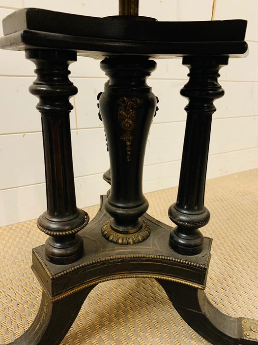 An ebonized and gilt revolving piano/music stool - Image 2 of 4
