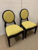 Two bedroom chairs,by PIERRE CRONJE with yellow seat pads