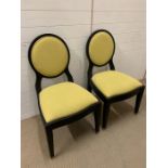 Two bedroom chairs,by PIERRE CRONJE with yellow seat pads