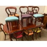 A regency style mahogany extending dining table with two leaves on four turned reeded legs (H74cm