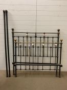 A wrought iron and brass knob bed frame 4.6