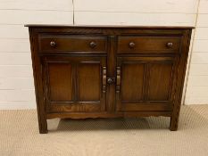 A Ercol sideboard, old colonial 1960's (H85cm W123cm D45cm)