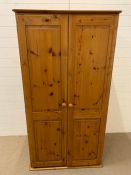 A two door pine wardrobe (H172cm W82cm)