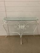 A metal side table with glass top (H73cm W92cm D36cm)