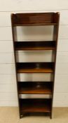 A small mahogany bookcase (H108cm W36cm D18cm)