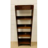 A small mahogany bookcase (H108cm W36cm D18cm)