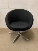 A modern black tub chair