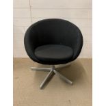 A modern black tub chair