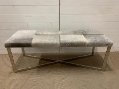 A Pony skin style bench on chrome legs