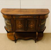 A 19th Century Credenza with glazed convex side windows, the shelved interior enclosed by two hinged