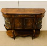 A 19th Century Credenza with glazed convex side windows, the shelved interior enclosed by two hinged